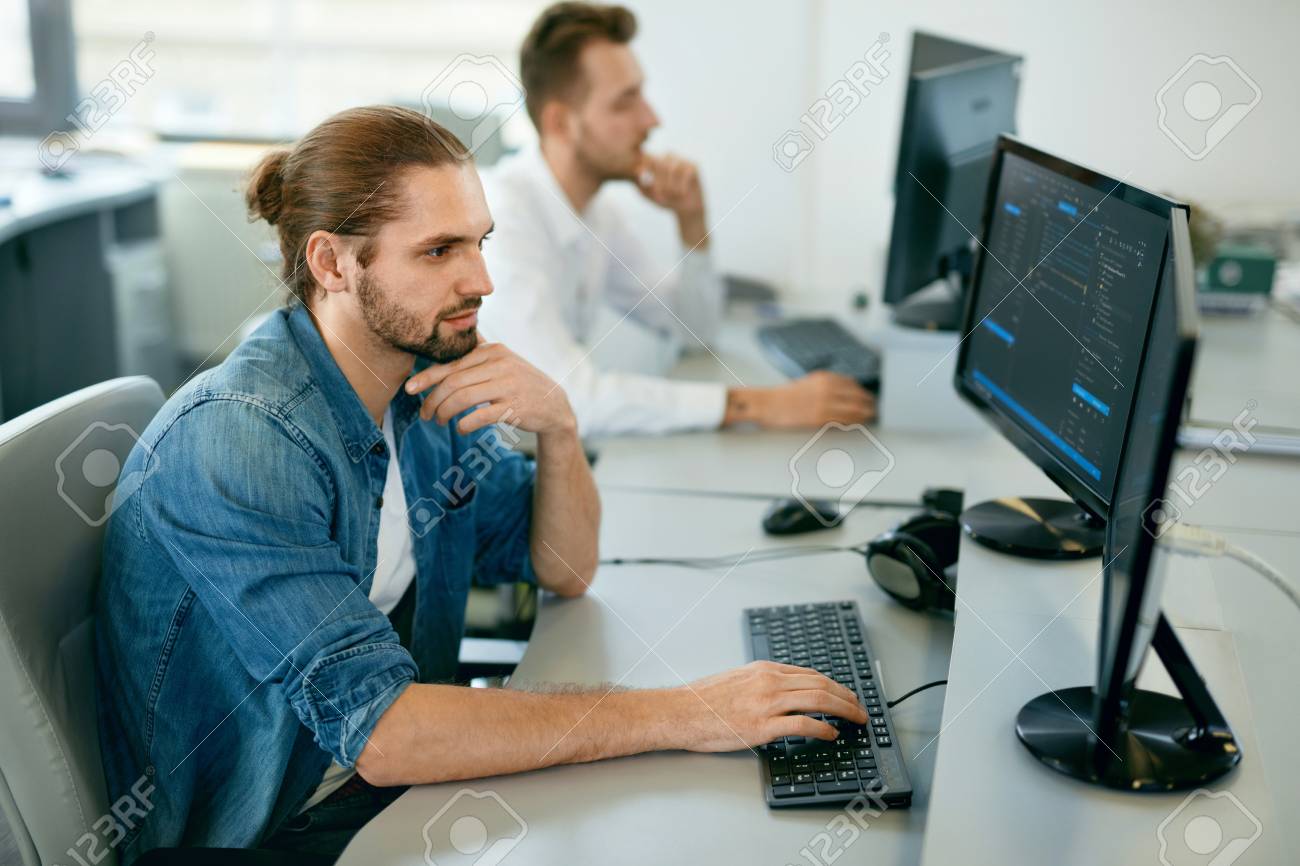 programmers working looking at