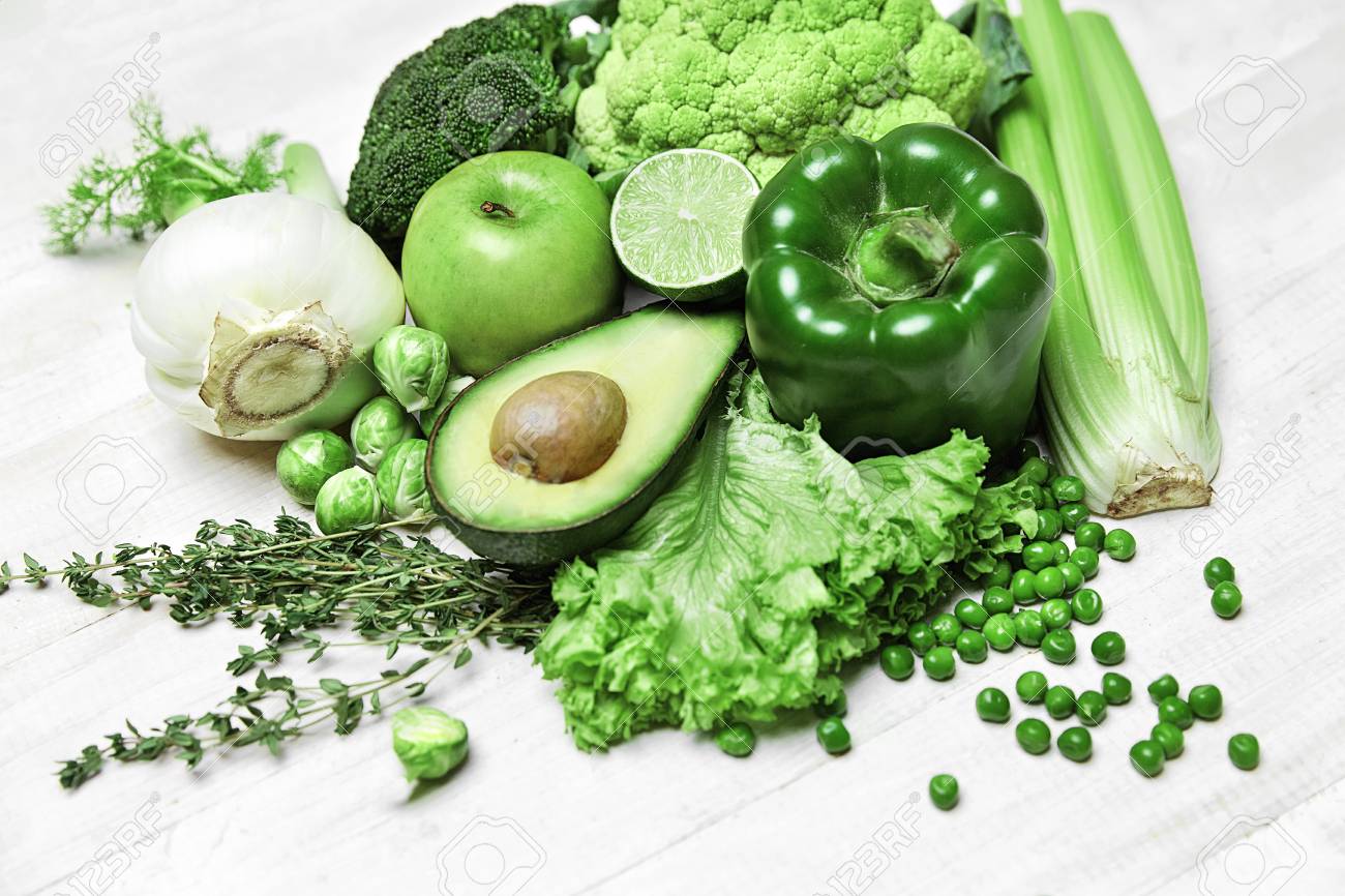 organic fresh food ingredients green vegetables on white background