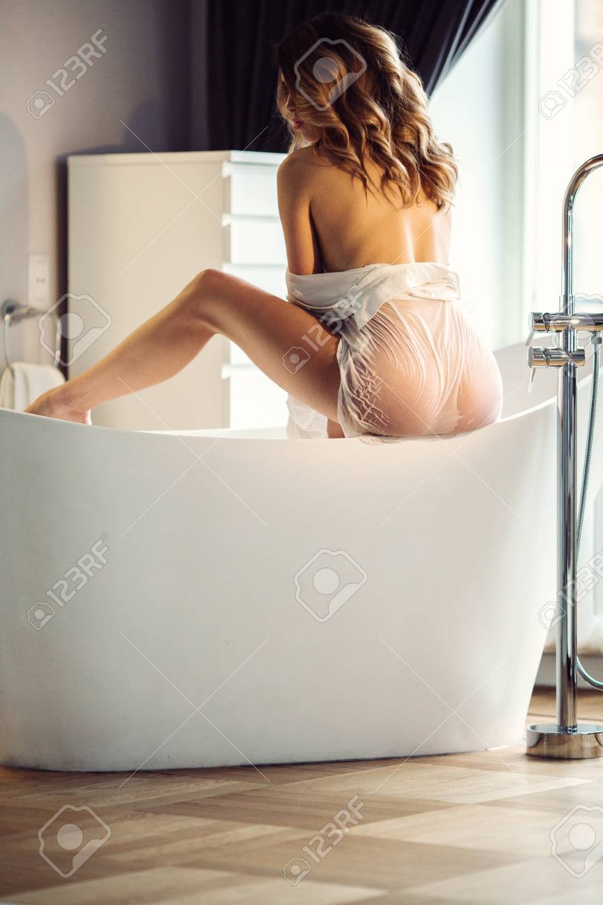 Beautiful Sexy Lady In Elegant White Shirt In A Bathroom Stock Photo,  Picture and Royalty Free Image. Image 100122160.