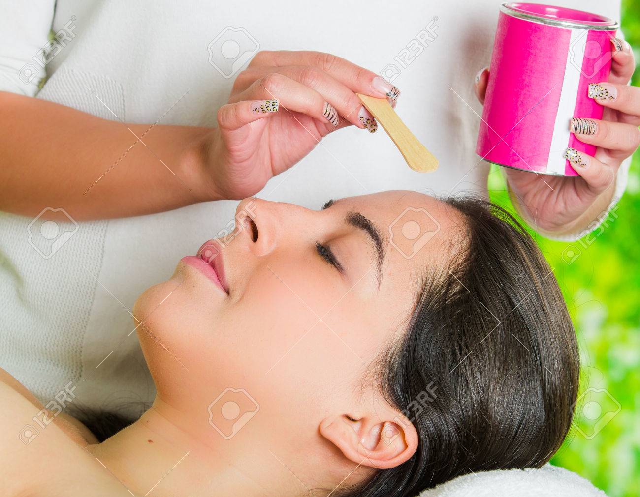 Closeup Womans Face Receiving Facial Hair Waxing Treatment Hand