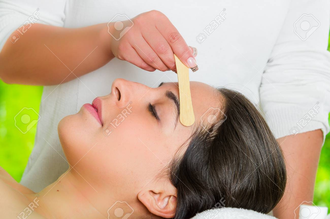 Closeup Womans Face Receiving Facial Hair Waxing Treatment Hand