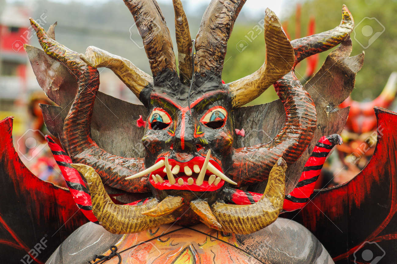 Quito, Ecuador - September, 03, 2018: Portrait of unidentified man dressed up and participating in the Diablada, popular town celebrations with people dressed as devils dancing in the streets - 120107218 Quito, Ecuador - September, 03, 2018: Portrait of unidentified man dressed up and participating in the Diablada, popular town celebrations with people dressed as devils dancing in the streets - 120107218