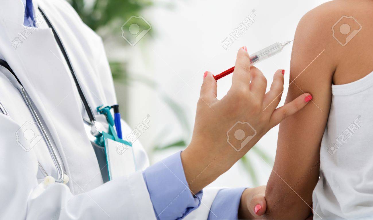 doctor making vaccination to the patient - 20705703 doctor making vaccination to the patient - 20705703