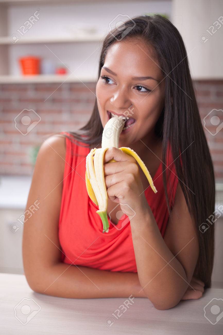 girl eating banana 