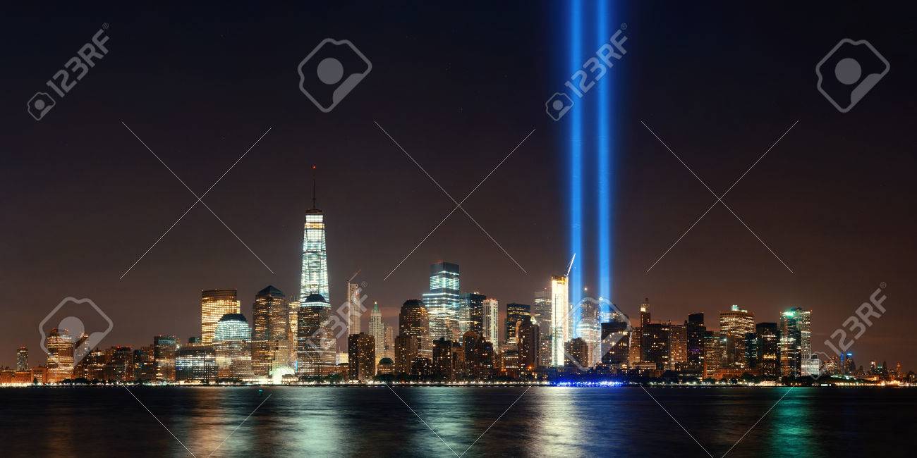 New York City downtown skyline at night panorama over Hudson River and September 11 tribute light - 60906033 New York City downtown skyline at night panorama over Hudson River and September 11 tribute light - 60906033