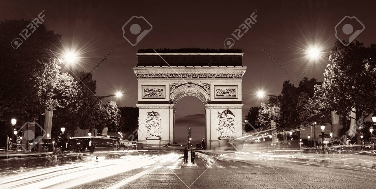 Arc De Triomphe And Street View Panorama At Night In Paris France