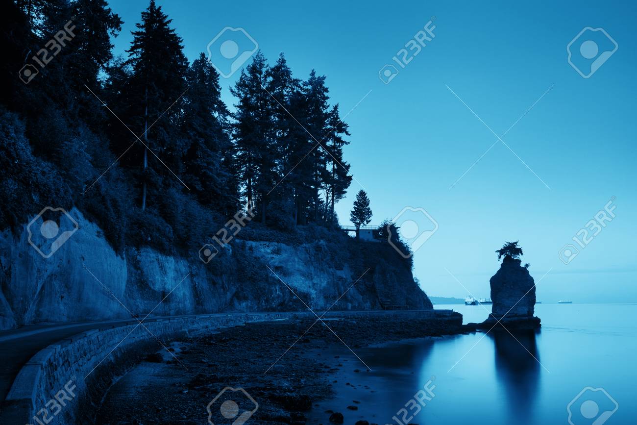 Siwash Rock In Stanley Park At Sunrise In Vancouver Stock Photo