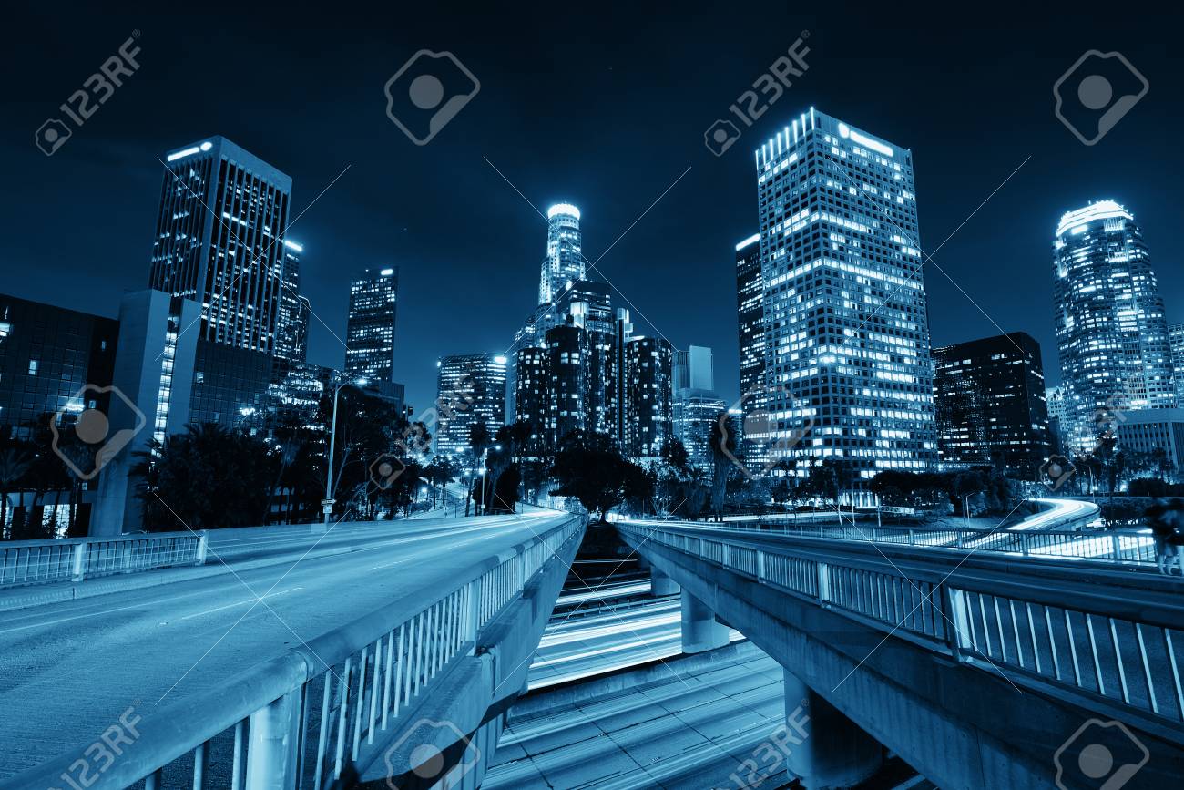 Los Angeles downtown at night with urban buildings and light trail - 90330901 Los Angeles downtown at night with urban buildings and light trail - 90330901