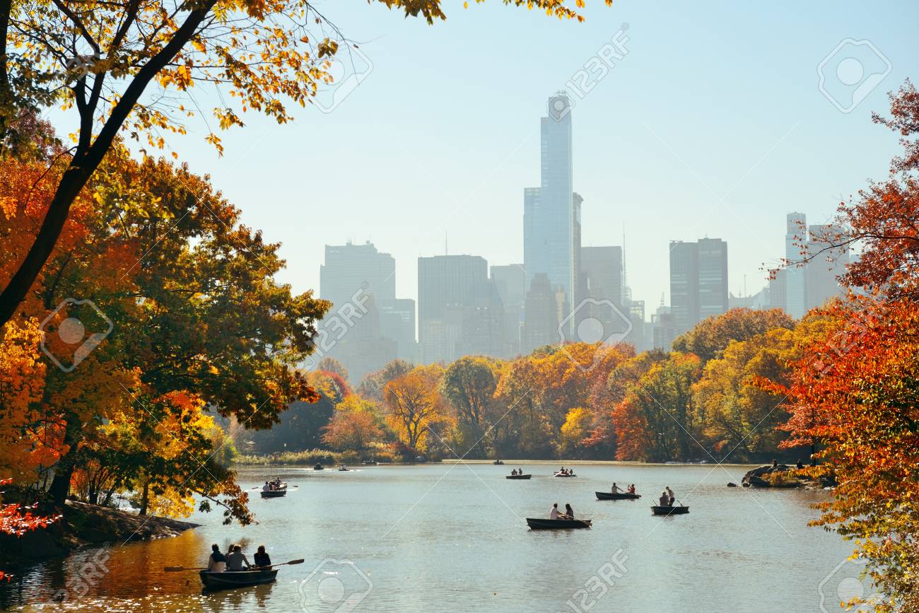People boating in lake in Central Park in Autumn New York City - 100321608 People boating in lake in Central Park in Autumn New York City - 100321608