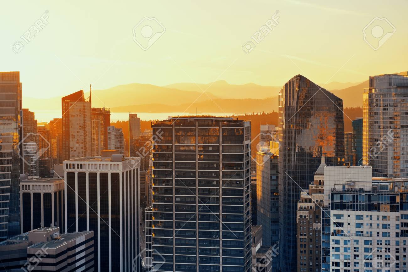 Vancouver rooftop view with urban architectures at sunset. - 100219573 Vancouver rooftop view with urban architectures at sunset. - 100219573