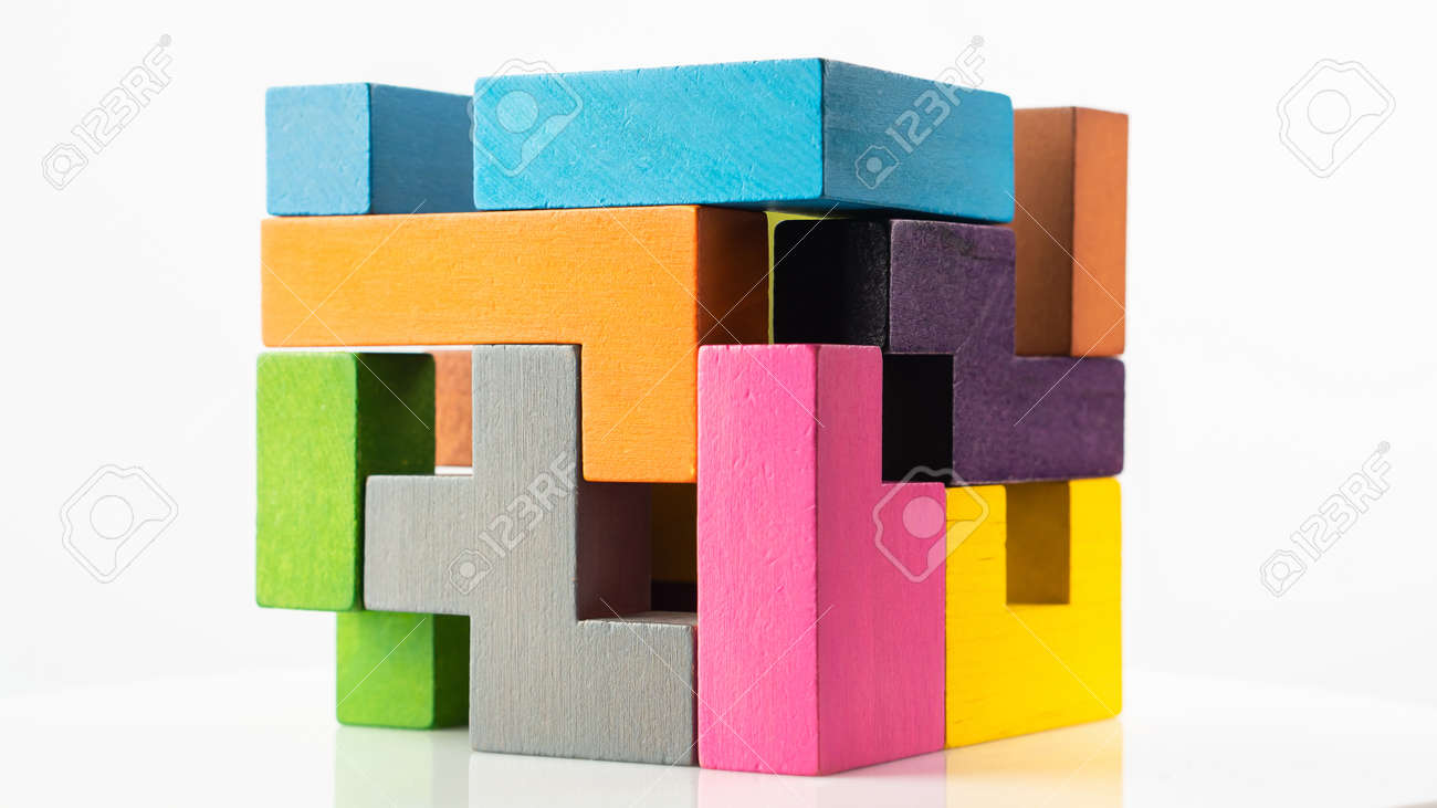 Cube made of multicolored wooden figures on a white background. Concept of logical thinking. - 166283937 Cube made of multicolored wooden figures on a white background. Concept of logical thinking. - 166283937