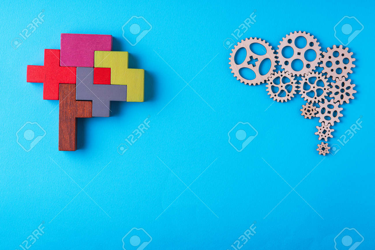 Human brain is made gear mechanism and colorful shapes on blue background. Two different thought processes. The concept of rational and irrational thinking. - 166110952 Human brain is made gear mechanism and colorful shapes on blue background. Two different thought processes. The concept of rational and irrational thinking. - 166110952