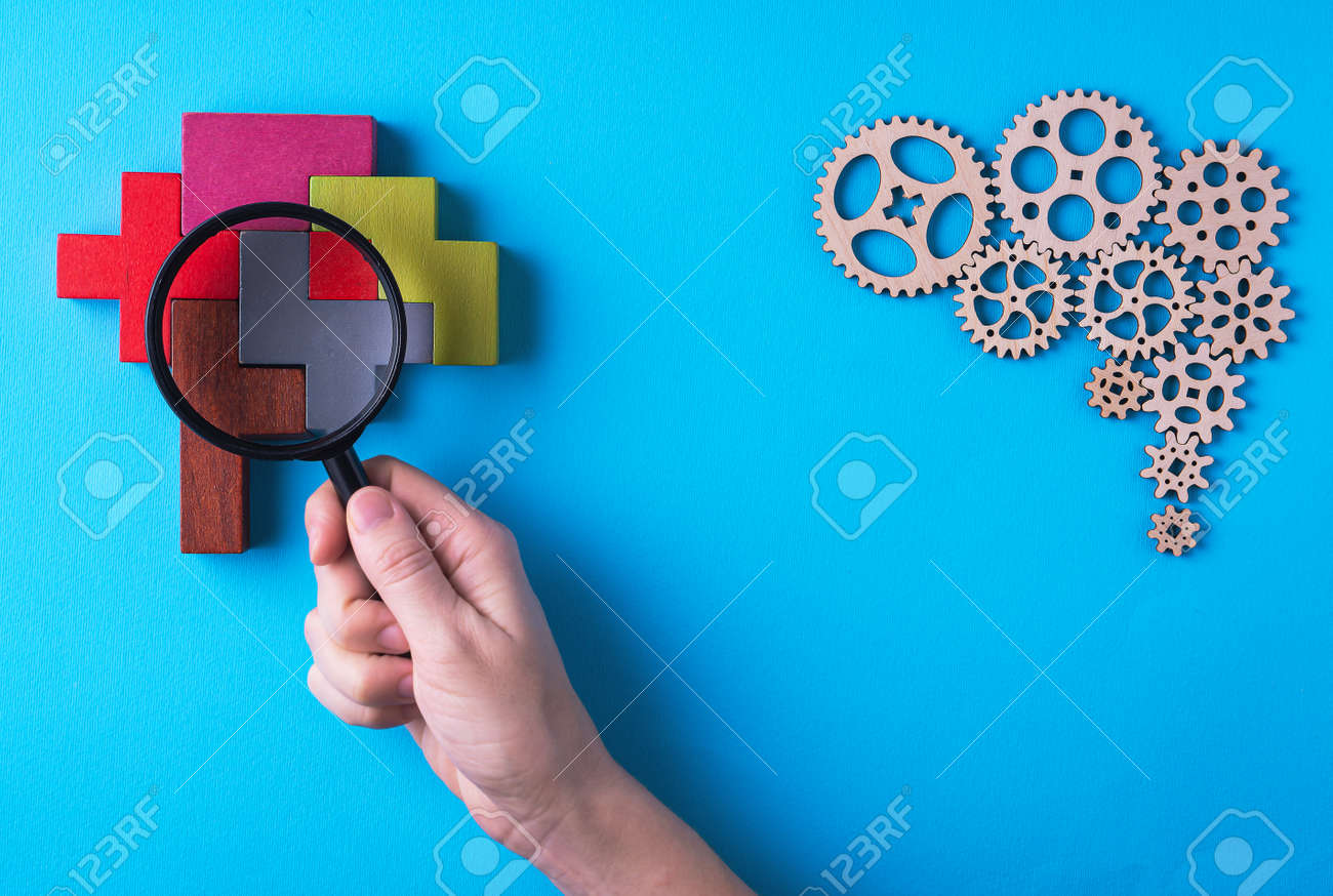 Human brain is made gear mechanism and colorful shapes on blue background. The brain is viewed through a magnifying glass. Two different thought processes, concept of different thinking. - 166460946 Human brain is made gear mechanism and colorful shapes on blue background. The brain is viewed through a magnifying glass. Two different thought processes, concept of different thinking. - 166460946