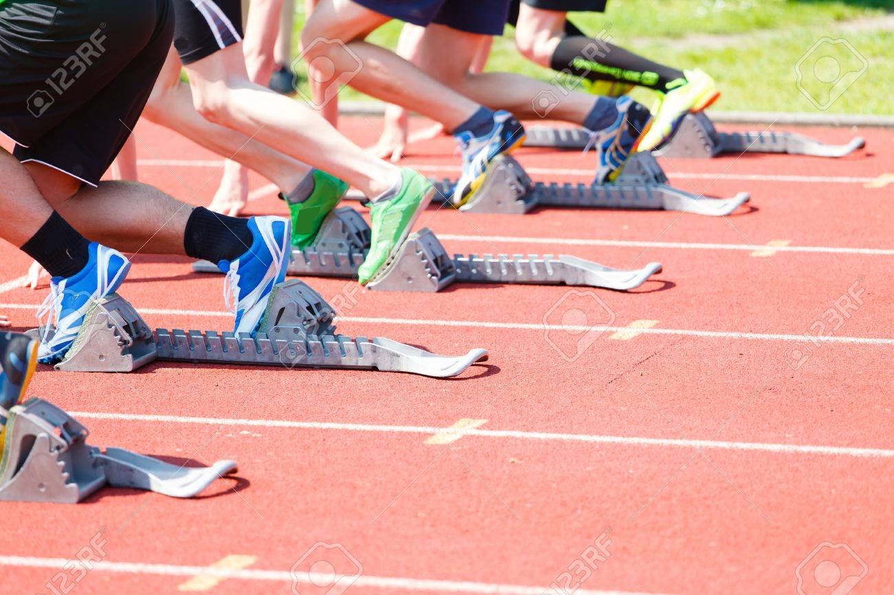 athletics sprint start athletes from athletics starting blocks