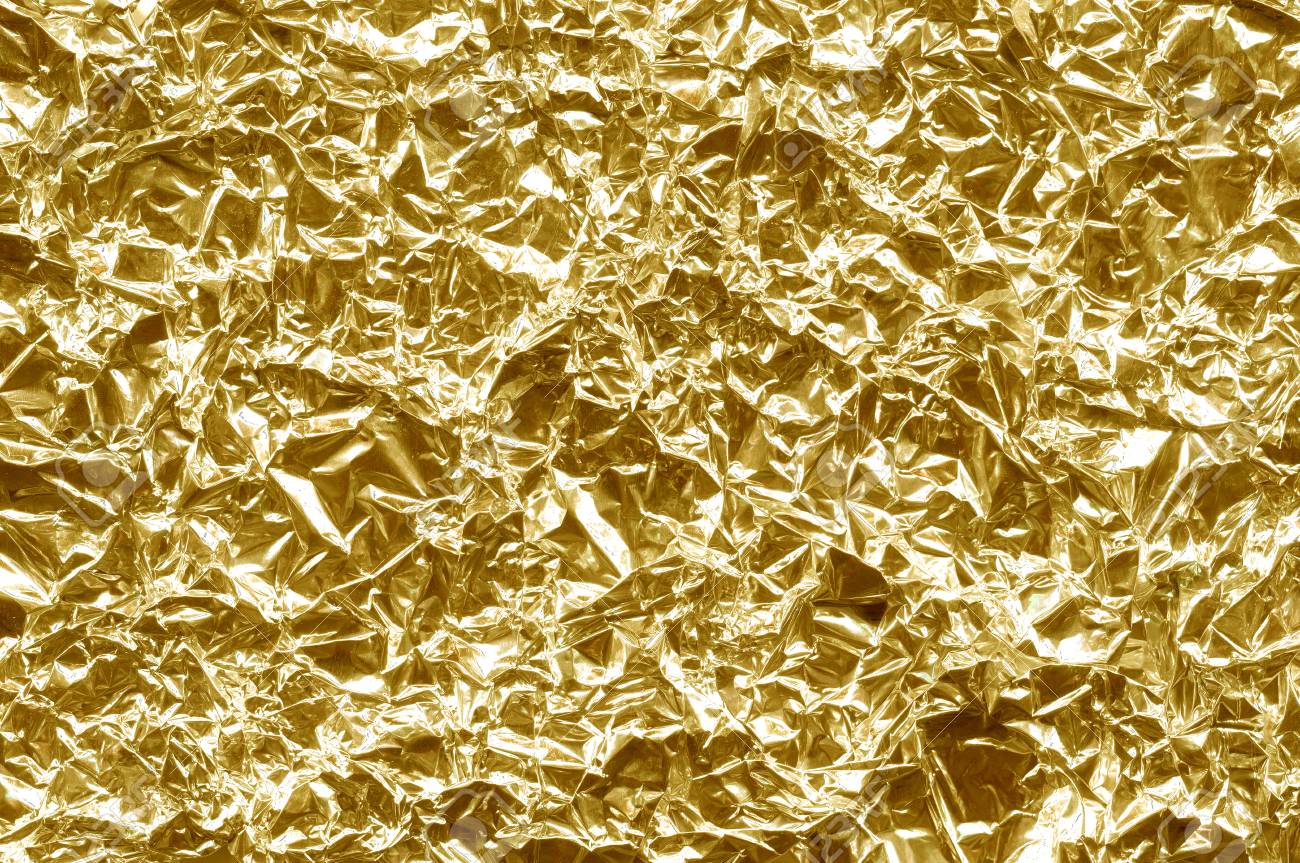 Fondo de la lámina. El color dorado brillante. Chispa de textura arrugada. Amarillo metalizado. Fondo de la lámina. El color dorado brillante. Chispa de textura arrugada. Amarillo metalizado.