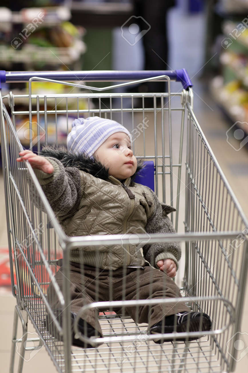 kid in shopping cart