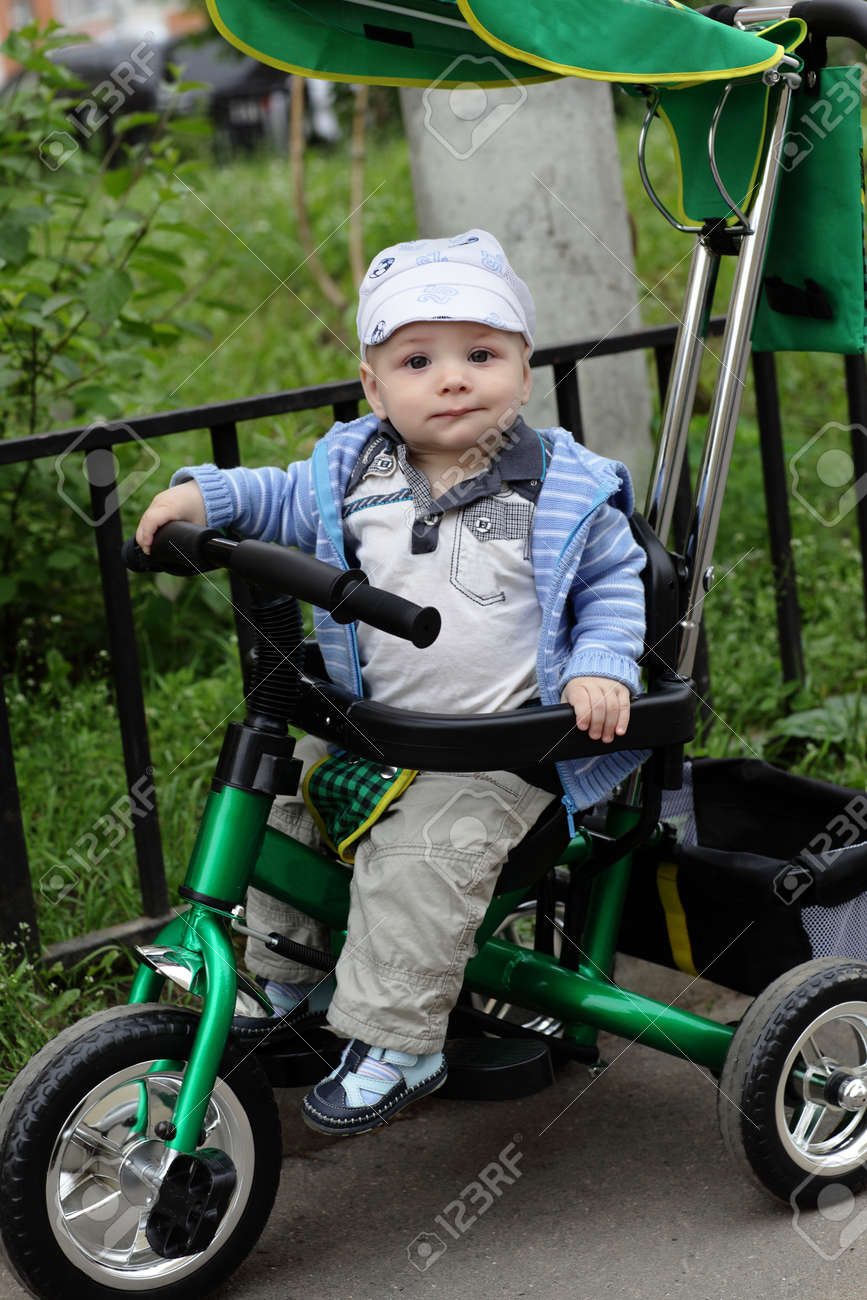 baby on tricycle