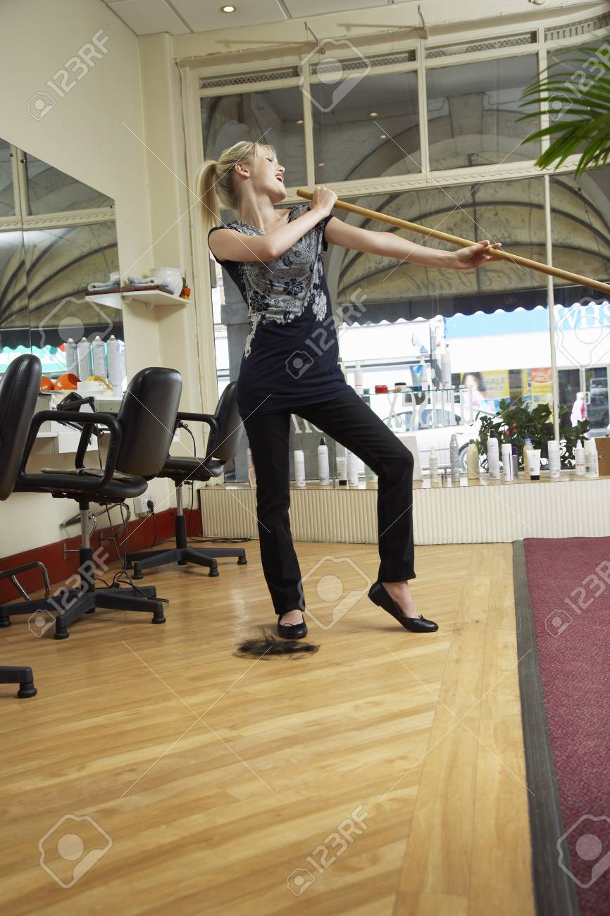Woman In Salon Singing Into Broom Stock Photo Picture And