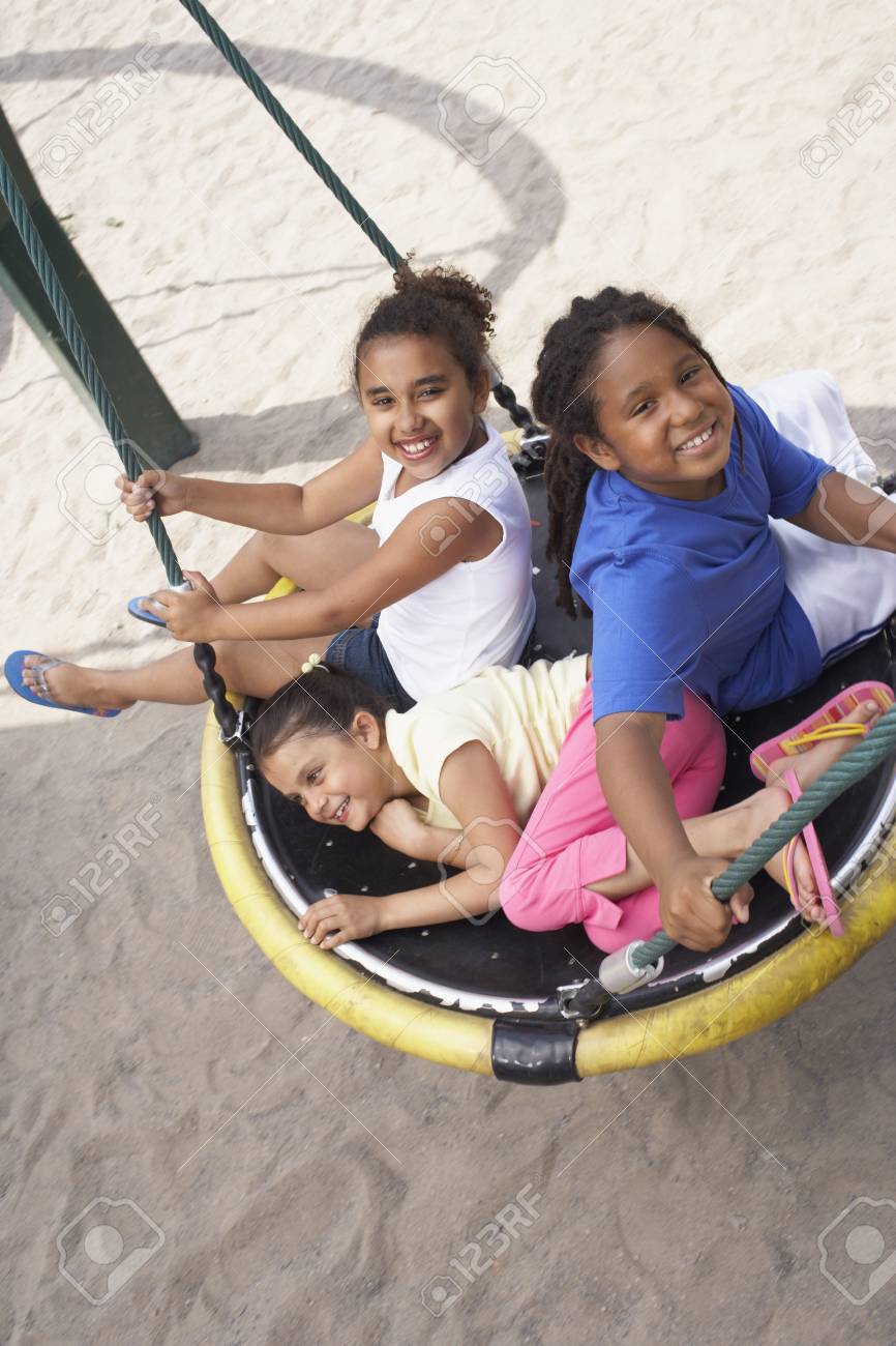children on swing stock