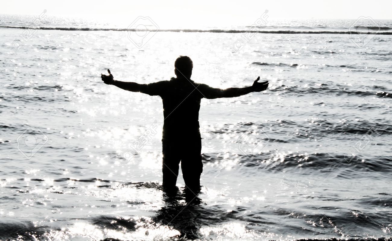 Sad Boy In Ocean - Feeling Relax Stock Photo, Picture And Royalty ...