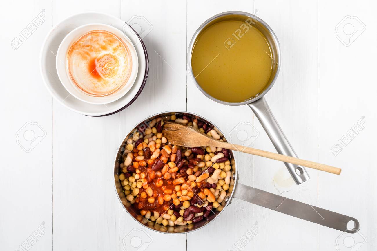 kitchen table with food. preparing chili bean stew on white wood kitchen table stock photo - 66273140 with food