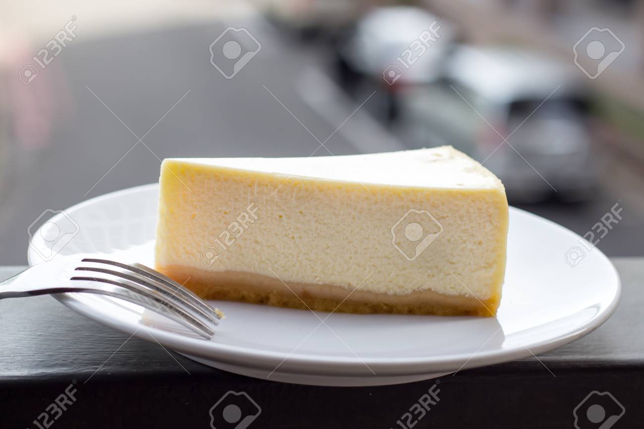 Cheesecake Slice Of Plain New York Cheesecake On White Plate