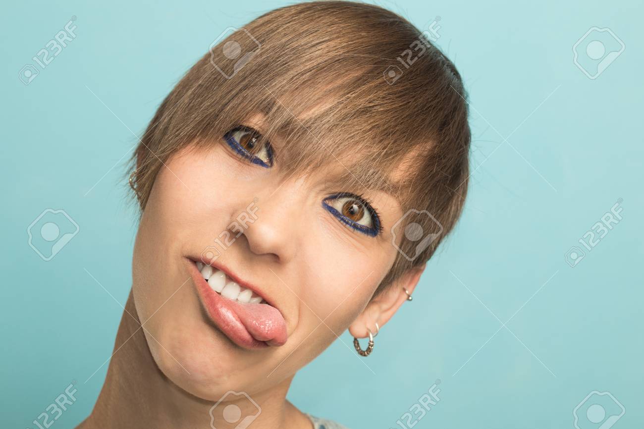 Woman With Short Hair Sticking Out Her Tongue With Funny