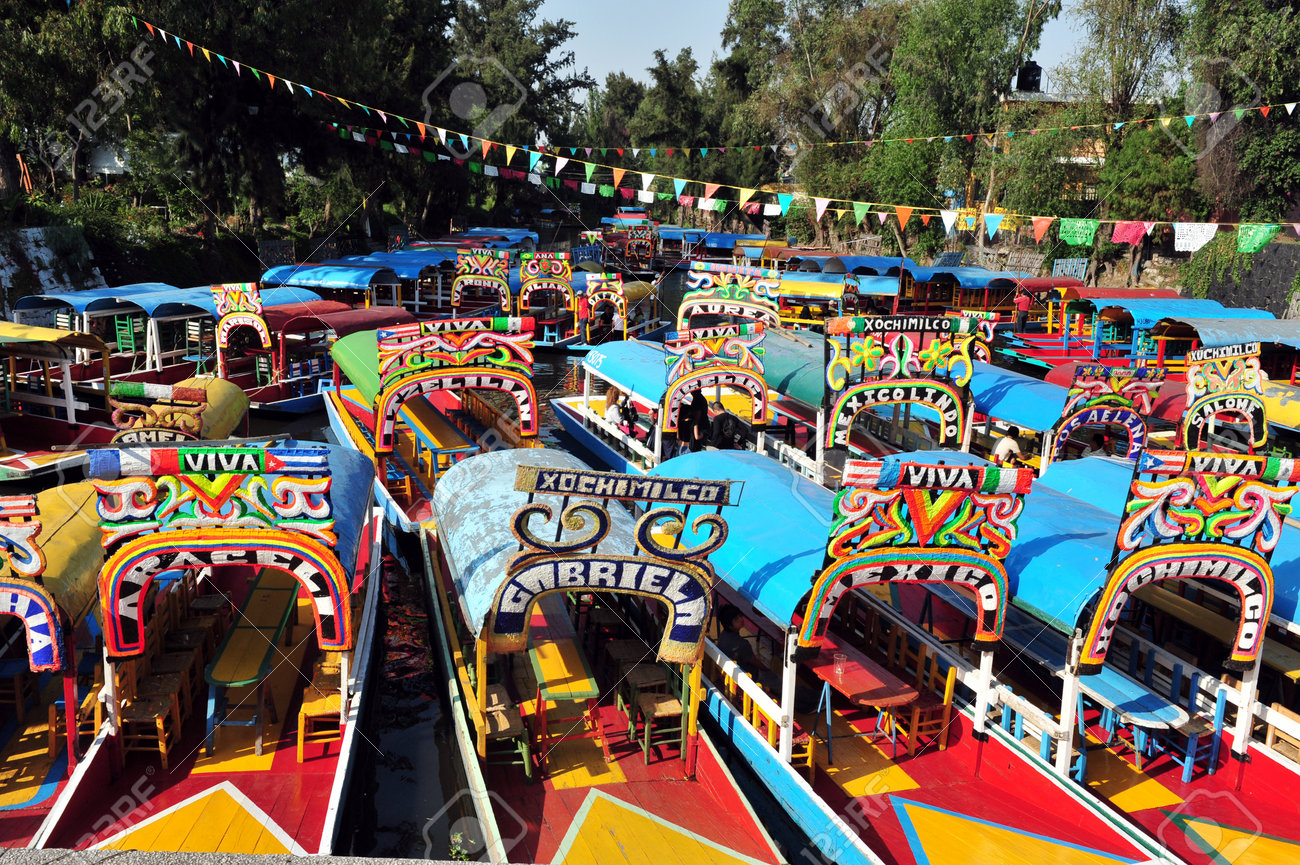 Colourful Mexican gondolas at Xochimilco's Floating Gardens in Mexico City. - 47605163 Colourful Mexican gondolas at Xochimilco's Floating Gardens in Mexico City. - 47605163