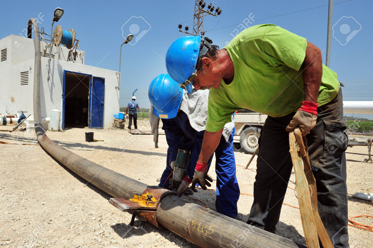 ashkelon august 05 drilling engineers and workers maintaining drilling engineer