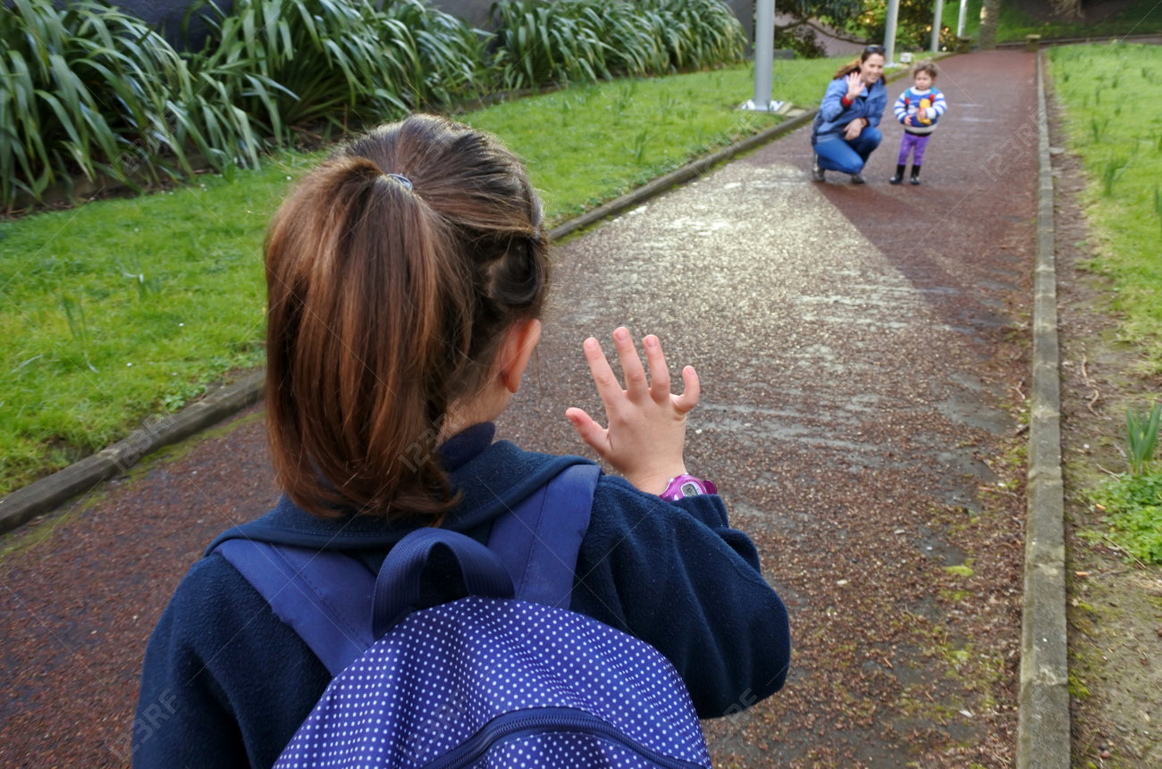 Little girl (age 5-6) going to school wave goodbye to her mother. People education concept - 62201451 Little girl (age 5-6) going to school wave goodbye to her mother. People education concept - 62201451