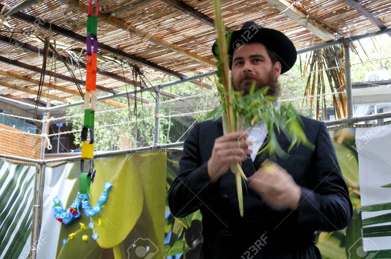 Jewish Orthodox Rabbi Blessing On The Four Species In A Sukkah.. Stock  Photo, Picture And Royalty Free Image. Image 89998812.