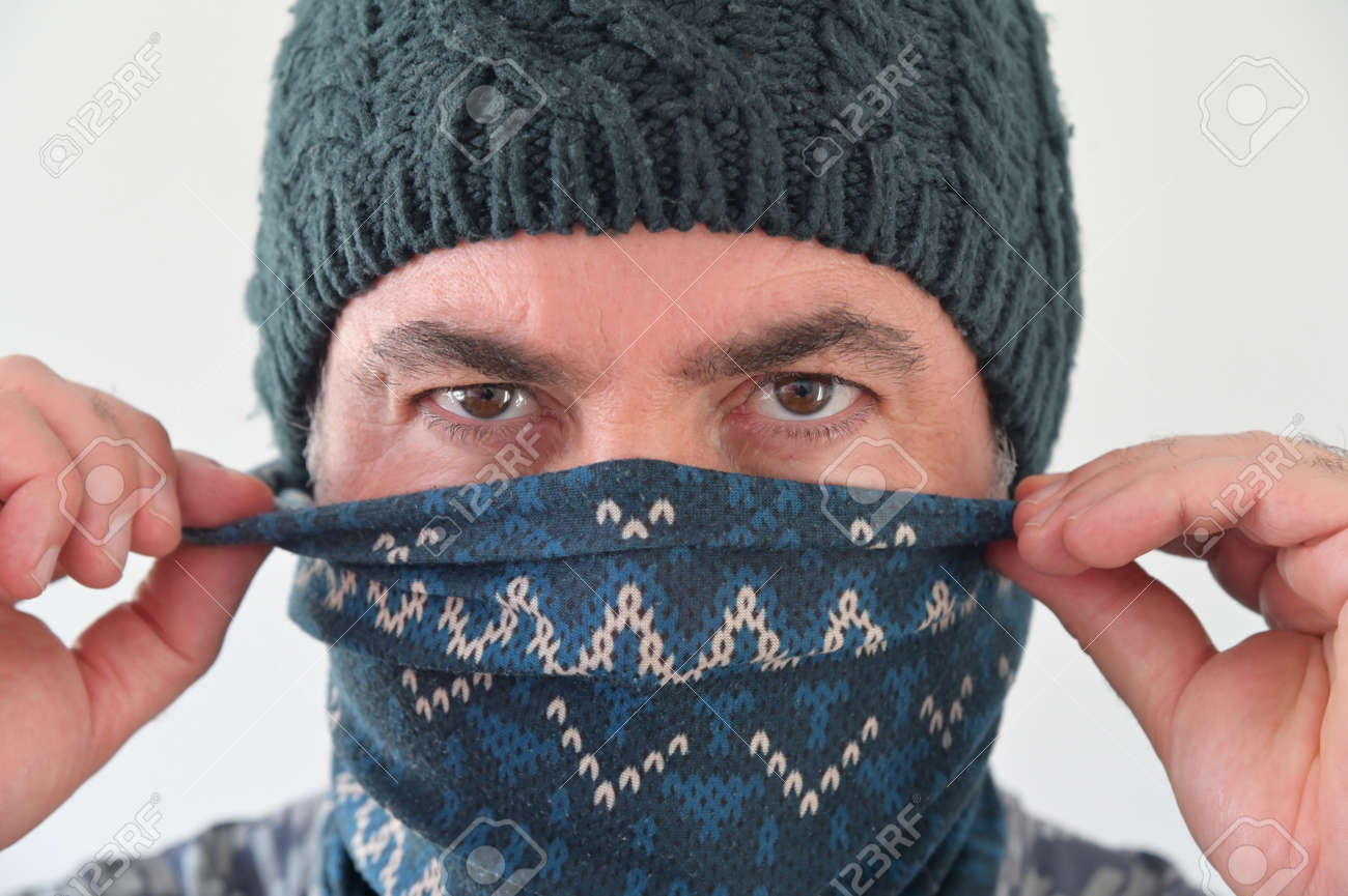 Middle Eastern Militant Man disguising his identity by wearing a beanie and balaclava face cover. - 169904715 Middle Eastern Militant Man disguising his identity by wearing a beanie and balaclava face cover. - 169904715