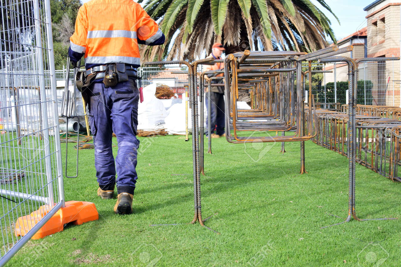 An unrecognizable Australian construction workers working outdoors. - 169904722 An unrecognizable Australian construction workers working outdoors. - 169904722