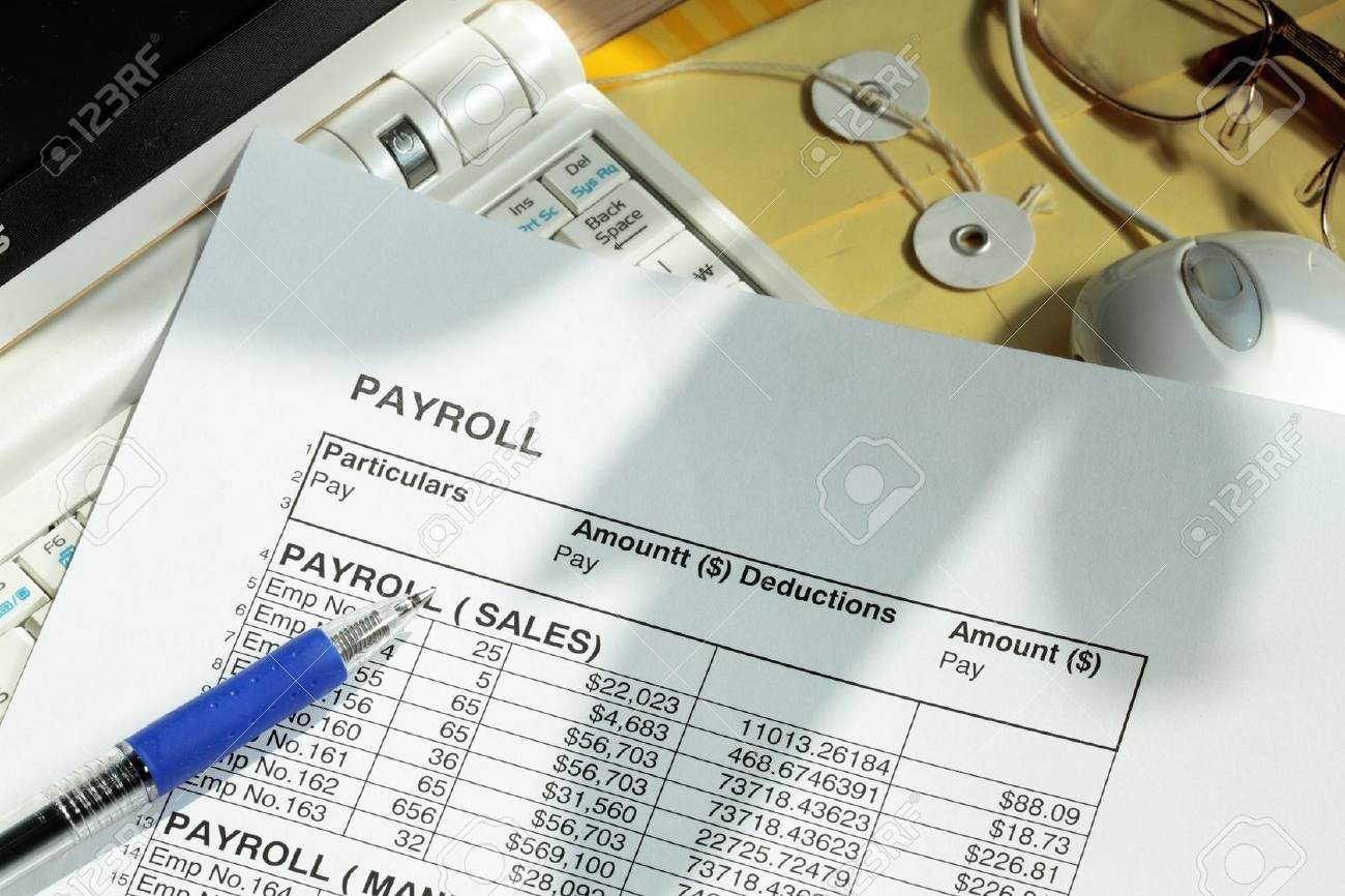 payroll spreadsheet with computer monitor and mouse payroll spreadsheet