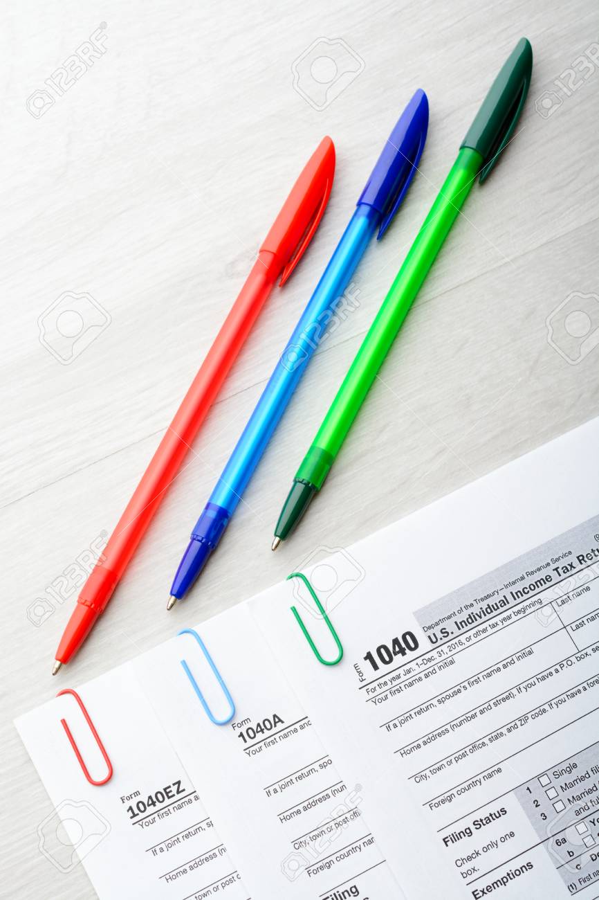 The Tax Return Form With Pen And Paper Clips Stock Photo Picture