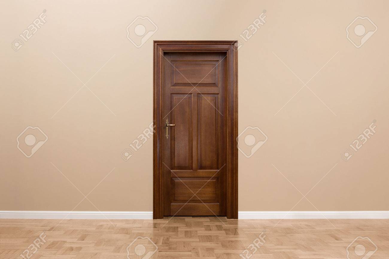 Wooden door in the empty room with copy space - 31761160 Wooden door in the empty room with copy space - 31761160