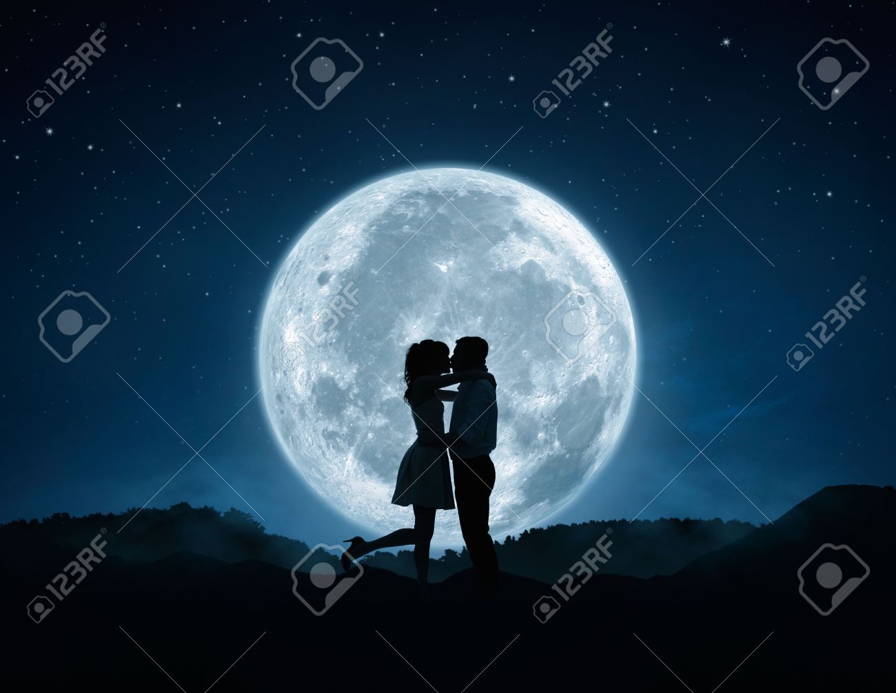 Silhouette of loving couple kissing agains the full moon - 35852731 Silhouette of loving couple kissing agains the full moon - 35852731