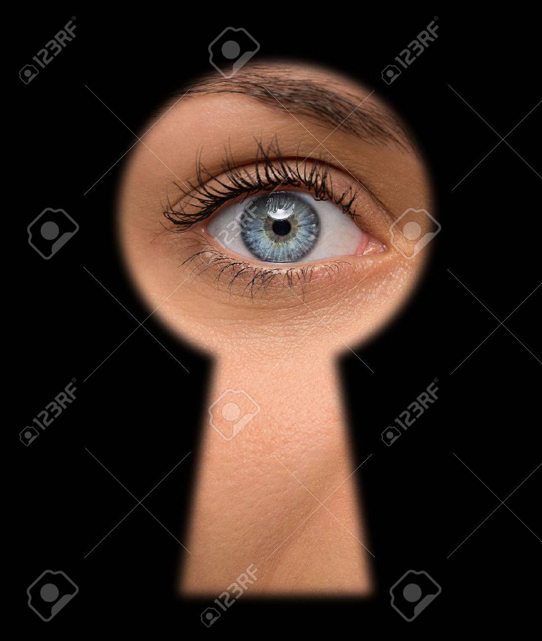 Close up of shocked female eye looking through a keyhole - 43608544 Close up of shocked female eye looking through a keyhole - 43608544
