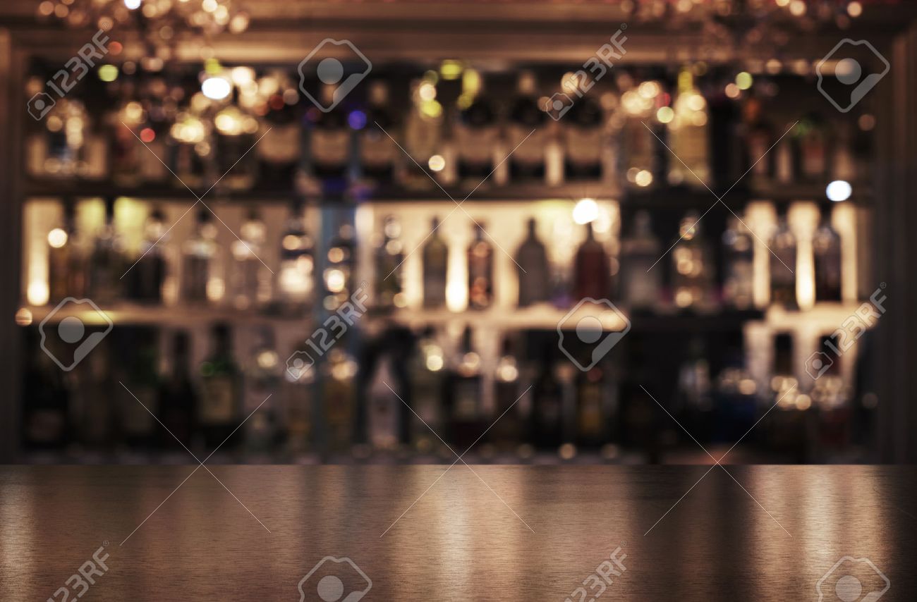 empty wooden bar counter with defocused background of restaurant