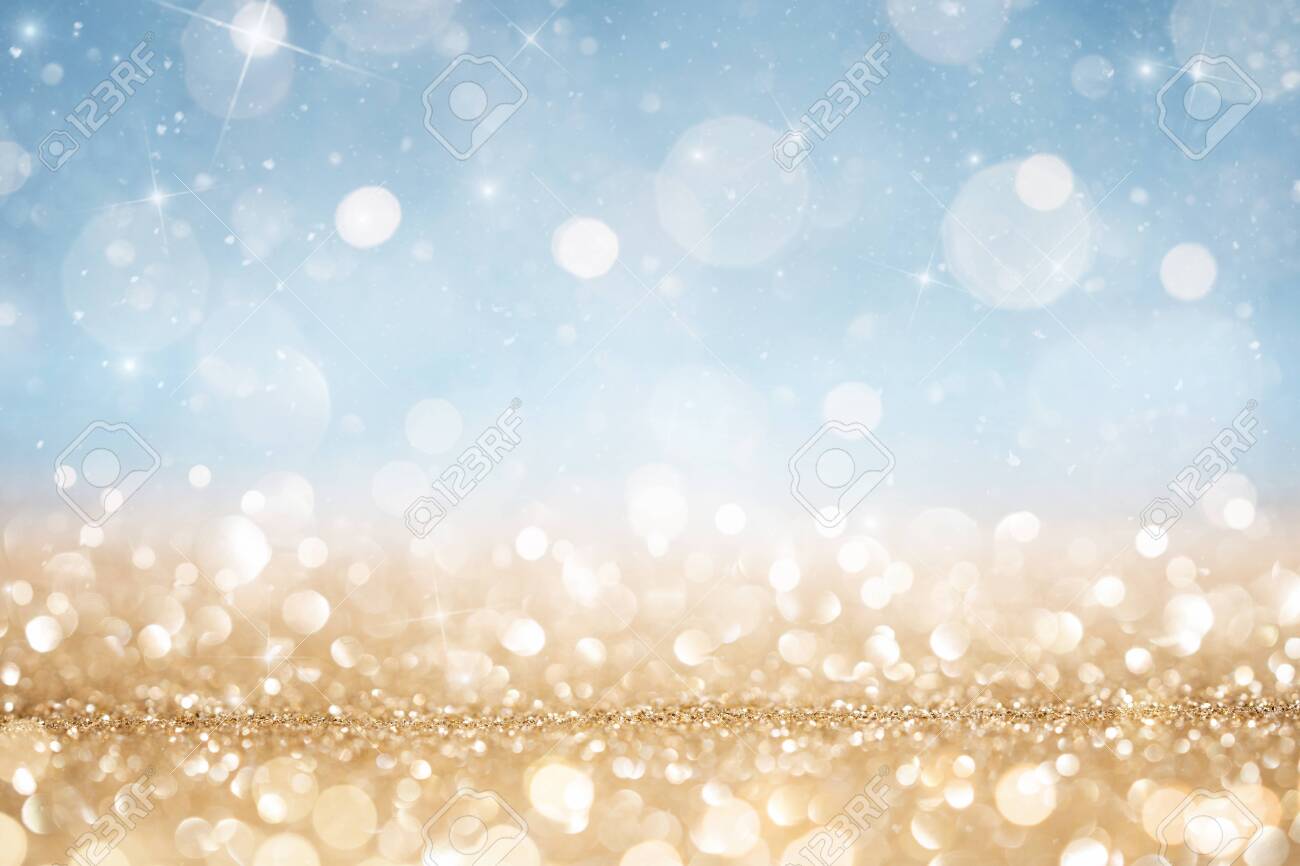 Abstract defocused gold and blue glitter background with copy space - 134335649 Abstract defocused gold and blue glitter background with copy space - 134335649