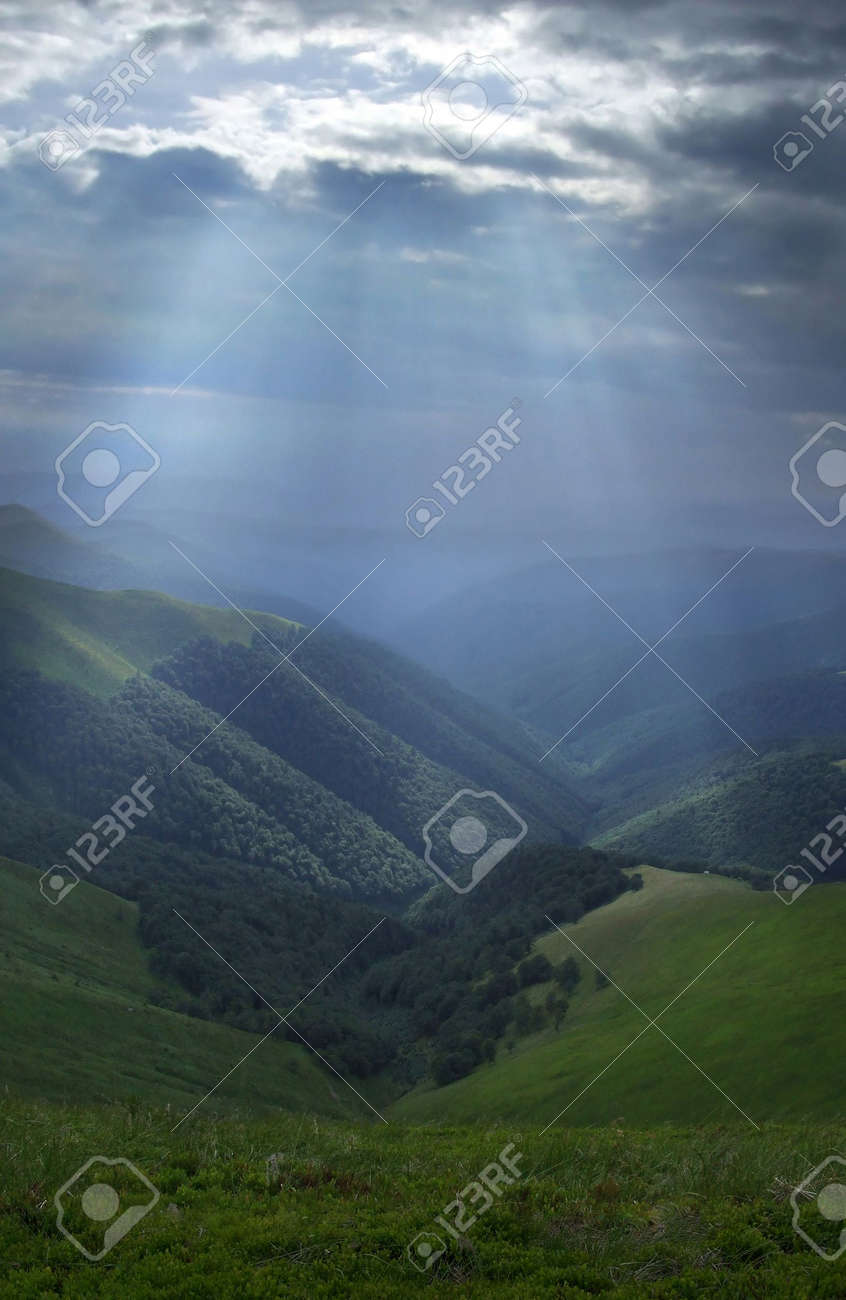 Mountain valley lightened by bright sunrays - 1828159 Mountain valley lightened by bright sunrays - 1828159
