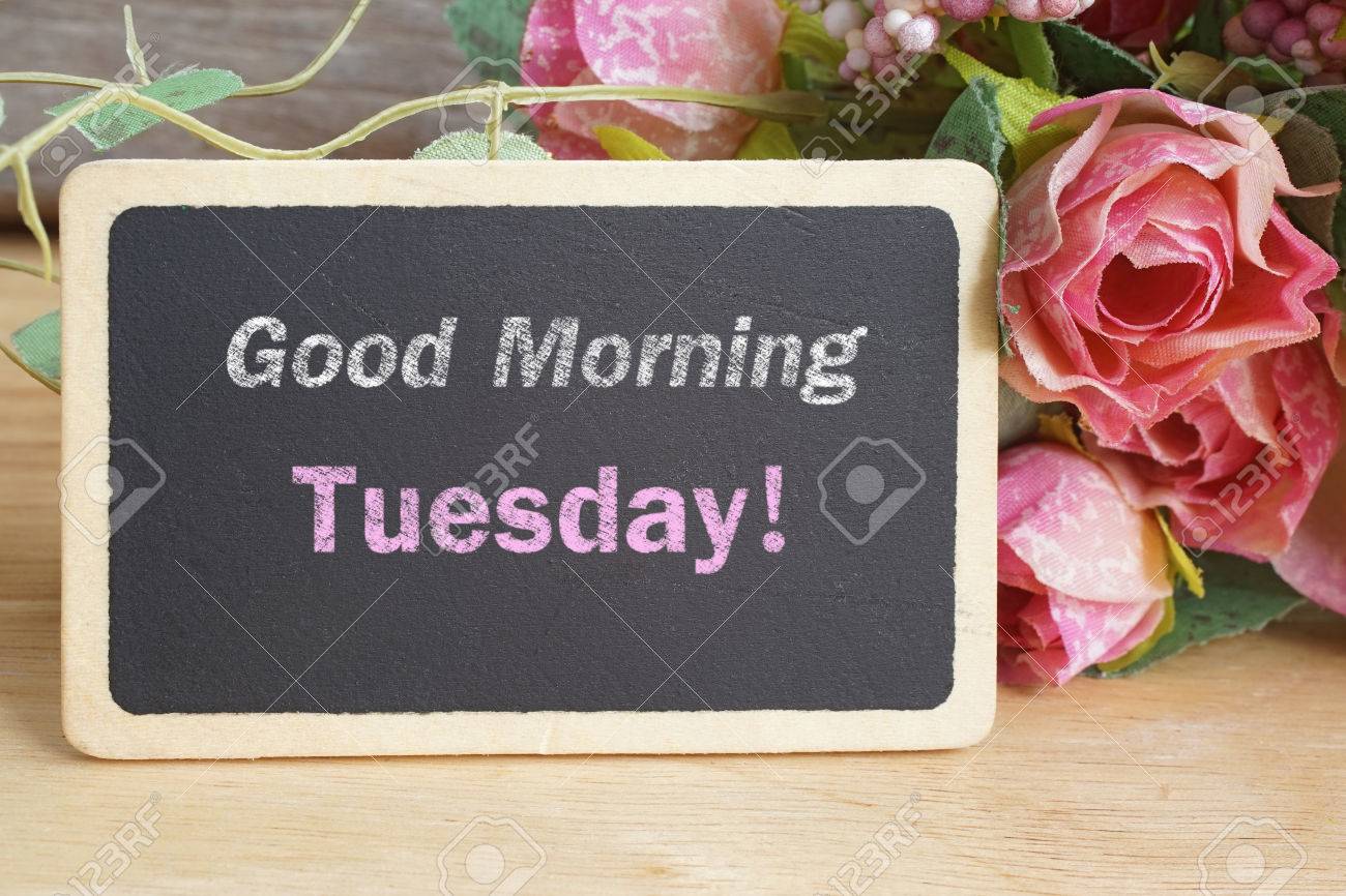 Good Morning Tuesday Word On Chalkboard With Roses Bouquet Stock