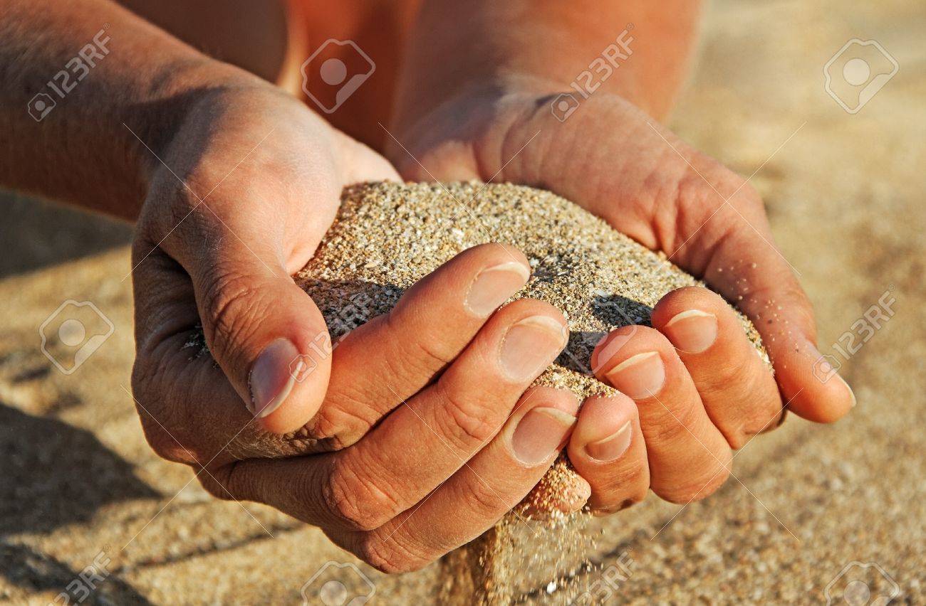 Woman With Sand In Her Hands Stock Photo Picture And Royalty Free Image Image 21609795