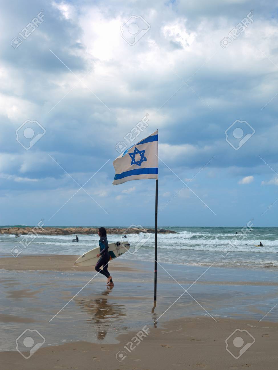 Surfer Is Running At The Banana Beach Of Mediterranean Sea In