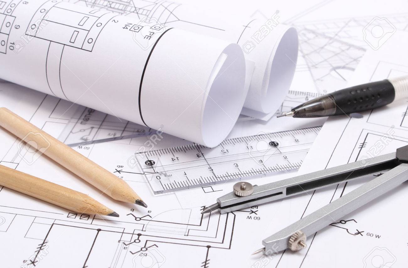 rolled electrical diagrams and accessories for drawing lying on construction drawing of house stock po rolled electrical diagrams and accessories for drawing lying on construction drawing of house stock po
