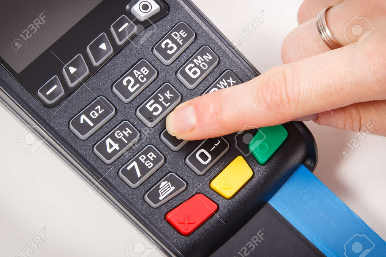 Payment terminal and finger entering PIN code. Credit card reader using for cashless paying. Finance concept - 168775702 Payment terminal and finger entering PIN code. Credit card reader using for cashless paying. Finance concept - 168775702