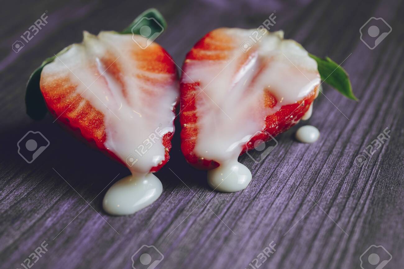 123920528-metaphor-of-sex-with-strawberries-and-milk-in-a-purple-wooden-table-vagina-and-semen-symbol-sex.jpg