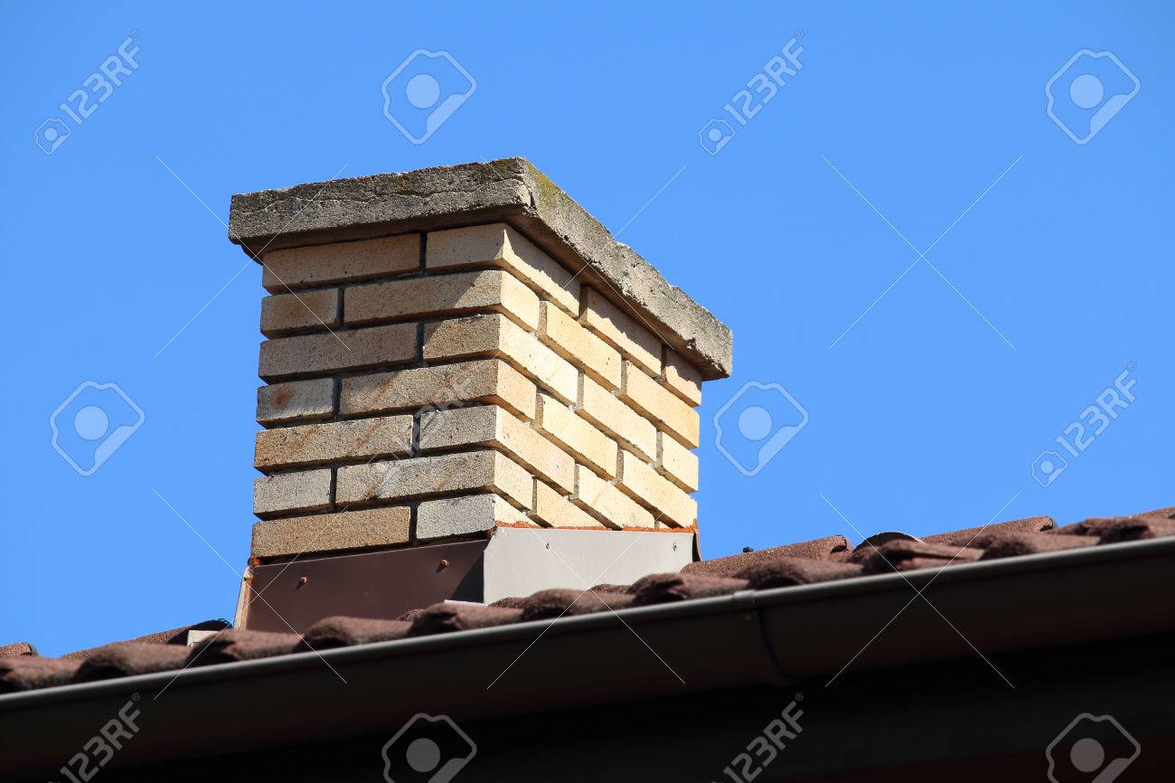 roof detail of a detached house with red roof tile and beige stock