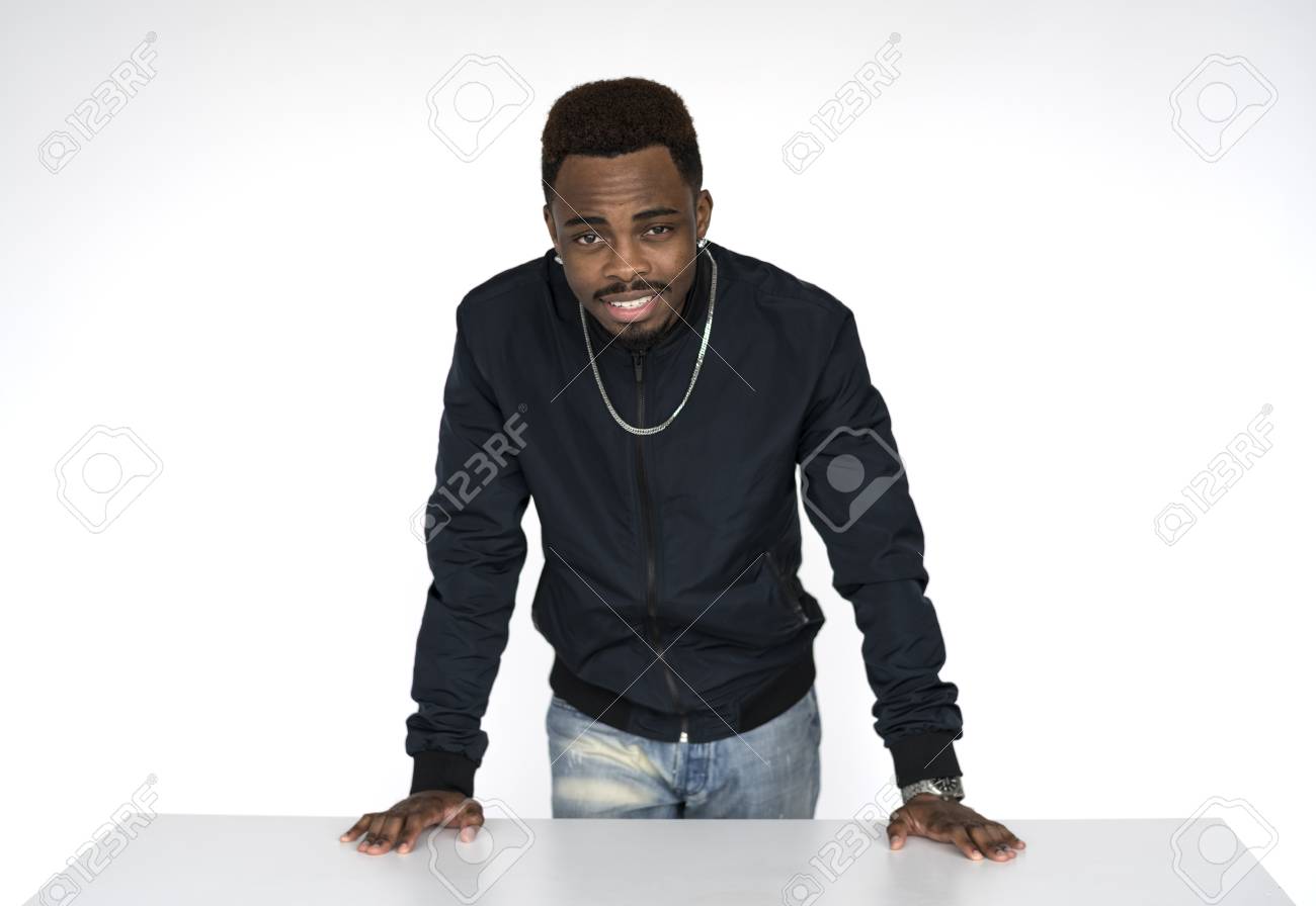 75989794-black-guy-resting-his-hands-on-the-table.jpg