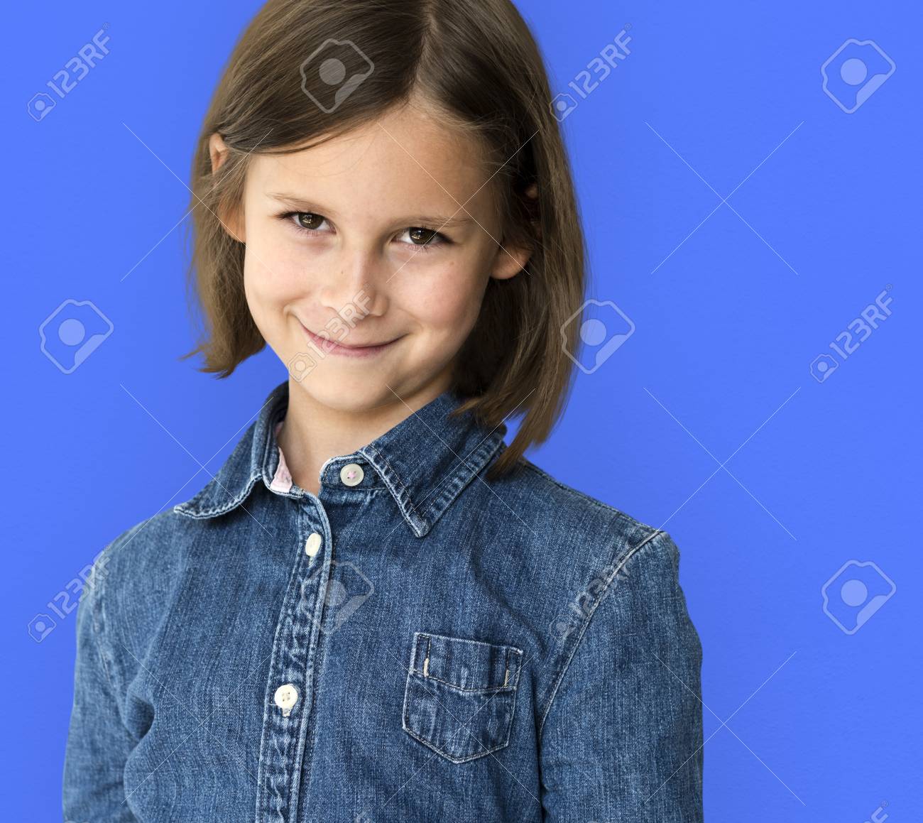 Short Haired Brunette Young Girl Smiling Studio Portrait Stock